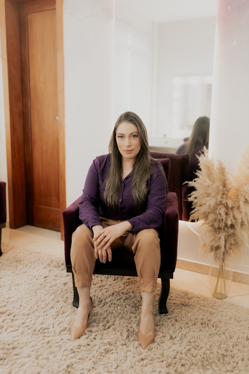 A woman sitting in a chair in a living room